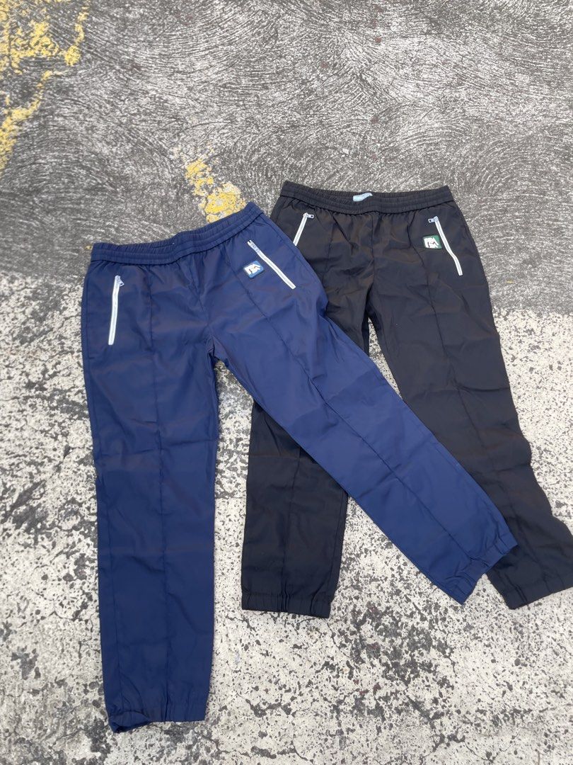 Prada Nylon pants rubber logo(Authentic) (Category: Luxury Apparel) located in Alegria. Submitted by deniseeee.21 (Listing ID 1470938672, Image 3). Description: 12k for bundle 7k if each so take it as bundle so you can have a huge discount AUTHENTIC LIKE NEW CONDITION SIZE 42s .