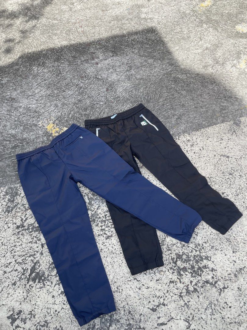 Prada Nylon pants rubber logo(Authentic) (Category: Luxury Apparel) located in Alegria. Submitted by deniseeee.21 (Listing ID 1470938672, Image 1). Description: 12k for bundle 7k if each so take it as bundle so you can have a huge discount AUTHENTIC LIKE NEW CONDITION SIZE 42s .