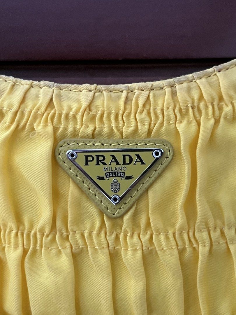 Prada nylon yellow sling shoulder bag (Category: Luxury Bags & Wallets) located in Manila. Submitted by all.love.thrift.shop.v2 (Listing ID 1470967562, Image 3). Description: For sale Prada yellow shoulder bag Complete details Rank AB ₱2,499 + sf only 📍 cainta rizal.