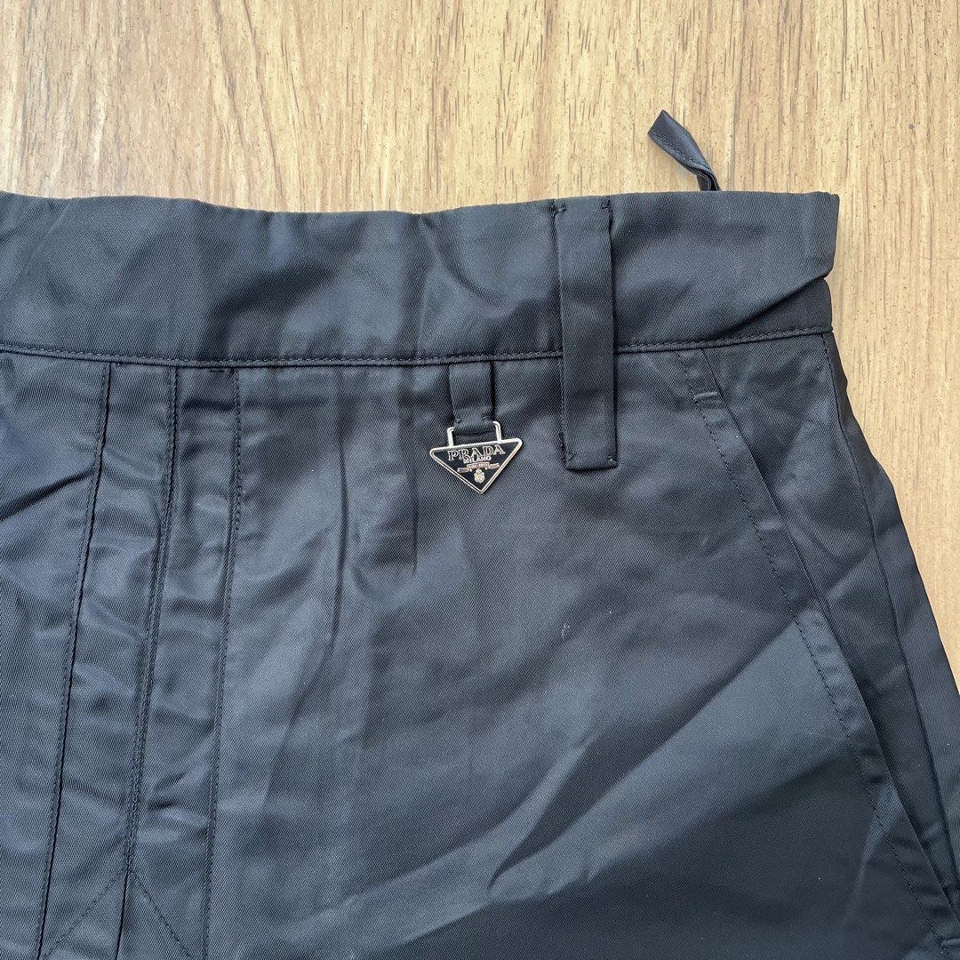 PRADA RE NYLON MINI SKIRT (Category: Skirts) located in Manila. Submitted by kramice (Listing ID 1471011428, Image 2). Description: PRADA RENYLON MINI SKIRT EXCE CONDI Length 16.5 Width 14 DM📩.