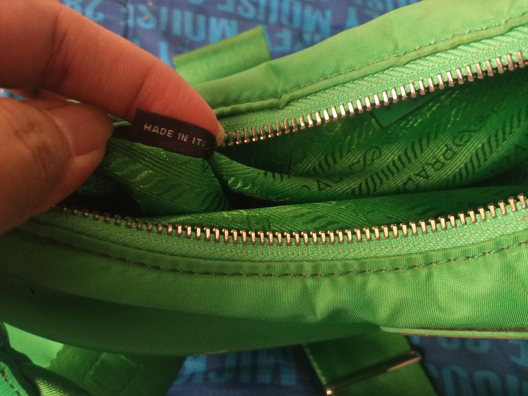Prada Re-Edition 2005 Green Nylon Bag (Category: Luxury Bags & Wallets) located in Manila. Submitted by littlelove25 (Listing ID 1470988687, Image 2). Description: - Authentic Green Prada Re-Edition 2005 shoulder bag in durable nylon - Includes matching detachable pouch and stylish key ring tag - Adjustable green fabric strap with sleek metal hardware - Secure top zip closure for everyday use - Interior lined with signature green jacquard fabric 