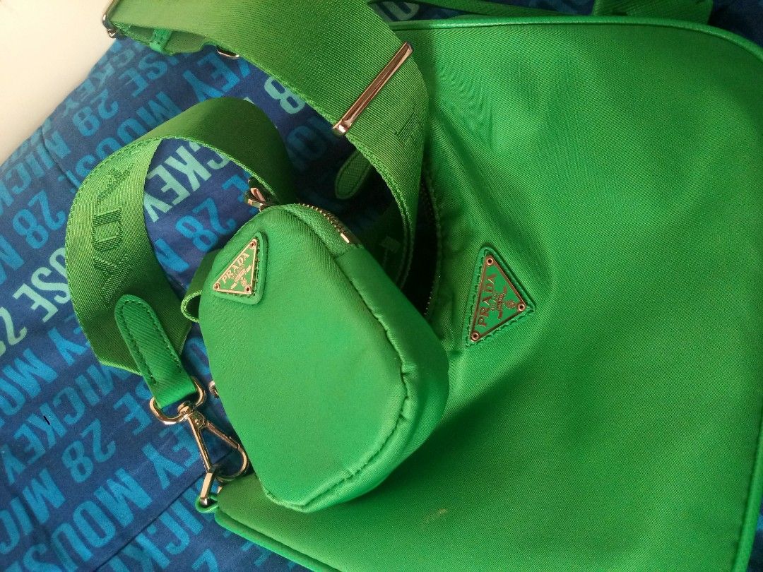 Prada Re-Edition 2005 Green Nylon Bag (Category: Luxury Bags & Wallets) located in Manila. Submitted by littlelove25 (Listing ID 1470988687, Image 3). Description: - Authentic Green Prada Re-Edition 2005 shoulder bag in durable nylon - Includes matching detachable pouch and stylish key ring tag - Adjustable green fabric strap with sleek metal hardware - Secure top zip closure for everyday use - Interior lined with signature green jacquard fabric 