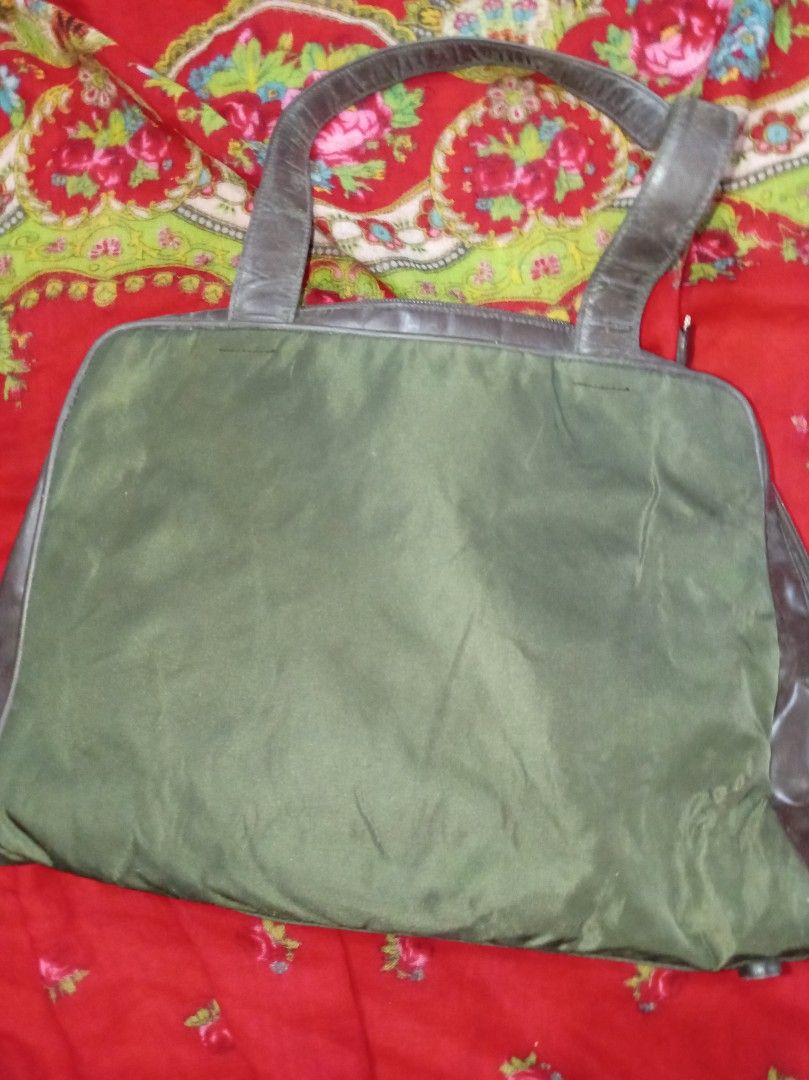 PRADA tessuto Nylon olive green shoulder bag (Category: Luxury Bags & Wallets) located in Malolos. Submitted by shoptokyothrift (Listing ID 1471049136, Image 2). Description: Vintage PRADA tessuto Nylon olive green shoulder bag With white tag With padlock and key As is Please Check all photos carefully.