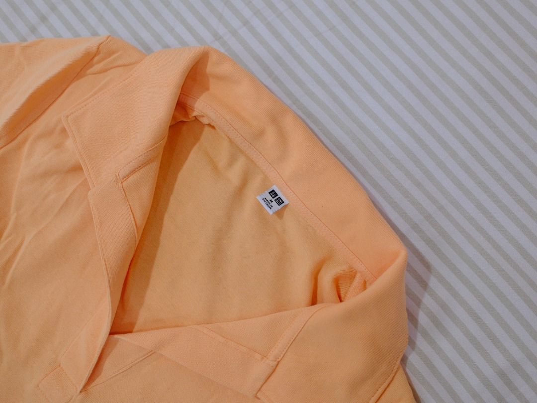 Pre-Loved Clothes | Uniqlo Light Orange Collared Crop Top (Category: Shirts) located in Obando. Submitted by chokbotsss (Listing ID 1471007759, Image 3). Description: Pre-Loved Clothes - Price: 100 - Brand: Uniqlo - Color: Light Orange - Size: M - Issue: None Payment: Gcash/Bank Transfer Delivery: Lalamove/LBC Location: Maysilo, Malabon City.