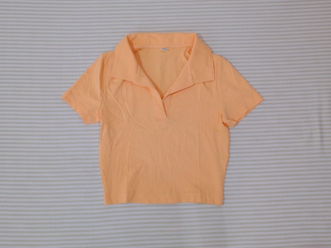 Pre-Loved Clothes | Uniqlo Light Orange Collared Crop Top (Category: Shirts) located in Obando. Submitted by chokbotsss (Listing ID 1471007759, Image 2). Description: Pre-Loved Clothes - Price: 100 - Brand: Uniqlo - Color: Light Orange - Size: M - Issue: None Payment: Gcash/Bank Transfer Delivery: Lalamove/LBC Location: Maysilo, Malabon City.