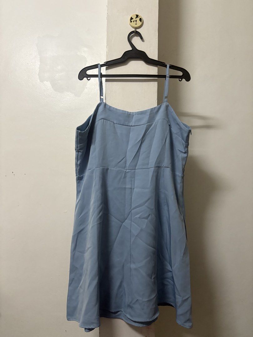 plus size preloved light blue spaghetti strap square neck mini dress (Category: Dresses) located in Quezon. Submitted by vakler23 (Listing ID 1471067306, Image 2). Description: - Color: Light blue - Style: Sleeveless mini dress with thin adjustable straps - Neckline: Square front with a straight-cut back - Fit: Fitted waist with a slightly flared skirt - Length: Above the knee - Fabric: Smooth, solid plain material - Perfect for casual wear and w