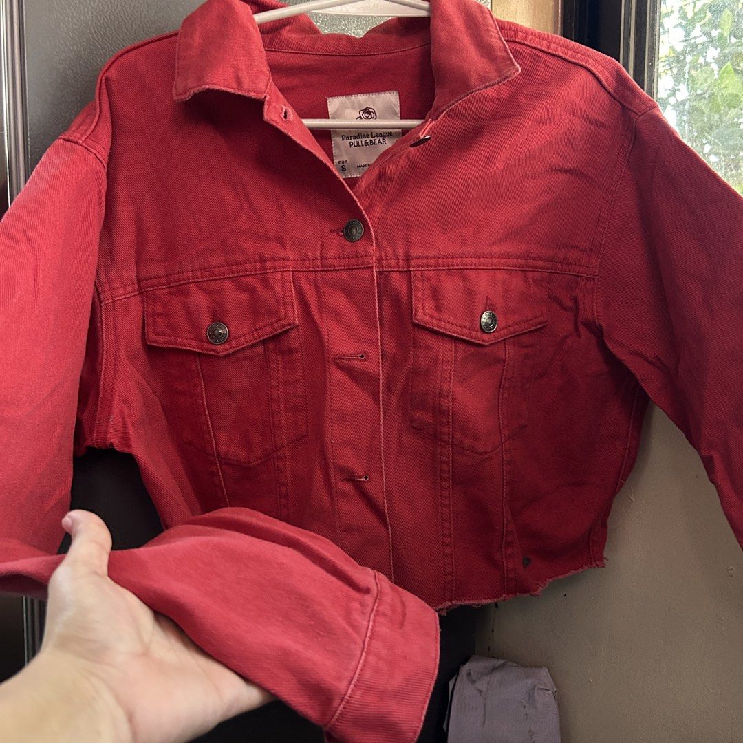 Pull & Bear Paradise League Red Denim Jacket (Category: Coats, Jackets and Outerwear) located in Manila. Submitted by tasha_11 (Listing ID 1471058992, Image 2). Description: - Brand: Pull & Bear (Paradise League collection) - Color: Vibrant Red - Size: S (EUR S, MEX 26) - Features: Classic collar, button-up front, two chest pockets, trendy raw hem detail - Condition: Great staple outerwear piece - Made in China.