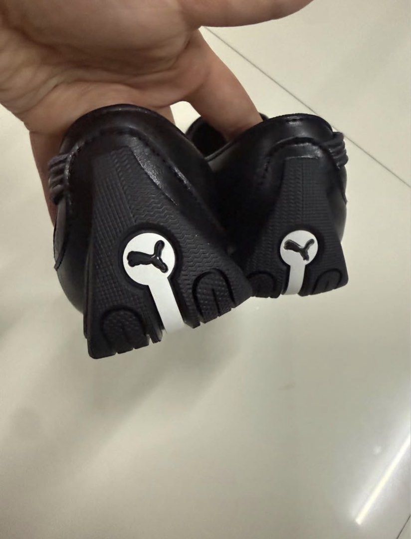 PUMA SLIPCAT BALLET WNS SNEAKERS (Category: Flats & Sandals) located in Cagayan de Oro. Submitted by onthemix (Listing ID 1471053820, Image 3). Description: - Brand: Puma - Style: Black flats with top strap closure - Size: US 5.5 / CM 22 - Comfort: Ortholite cushioned insoles with grid pattern footbed - Design: Smooth synthetic upper with glossy side panels and white Puma cat logo on heel and outsole - Condition: Excellent pre-loved / like new NE