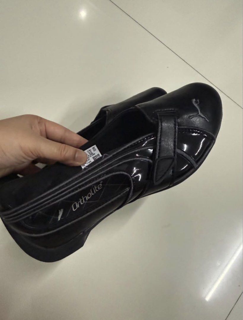 PUMA SLIPCAT BALLET WNS SNEAKERS (Category: Flats & Sandals) located in Cagayan de Oro. Submitted by onthemix (Listing ID 1471053820, Image 2). Description: - Brand: Puma - Style: Black flats with top strap closure - Size: US 5.5 / CM 22 - Comfort: Ortholite cushioned insoles with grid pattern footbed - Design: Smooth synthetic upper with glossy side panels and white Puma cat logo on heel and outsole - Condition: Excellent pre-loved / like new NE