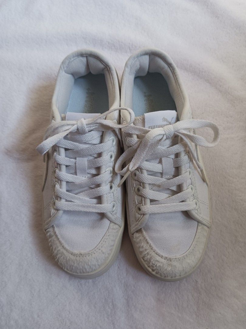 Puma White Canvas Platform Sneakers (Category: Sneakers) located in Malabon City. Submitted by mslalan (Listing ID 1470973813, Image 1). Description: - Brand: Puma - Style: White canvas low-top sneakers with thick platform soles - Size: US 6 / UK 3.5 / EU 36 - Details: Textured toe cap, heel counter, and stylish silver Puma branding - Condition: Clean canvas uppers with light wear on the soles underneath, ready to wear.