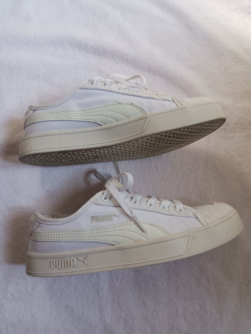 Puma White Canvas Platform Sneakers (Category: Sneakers) located in Malabon City. Submitted by mslalan (Listing ID 1470973813, Image 2). Description: - Brand: Puma - Style: White canvas low-top sneakers with thick platform soles - Size: US 6 / UK 3.5 / EU 36 - Details: Textured toe cap, heel counter, and stylish silver Puma branding - Condition: Clean canvas uppers with light wear on the soles underneath, ready to wear.