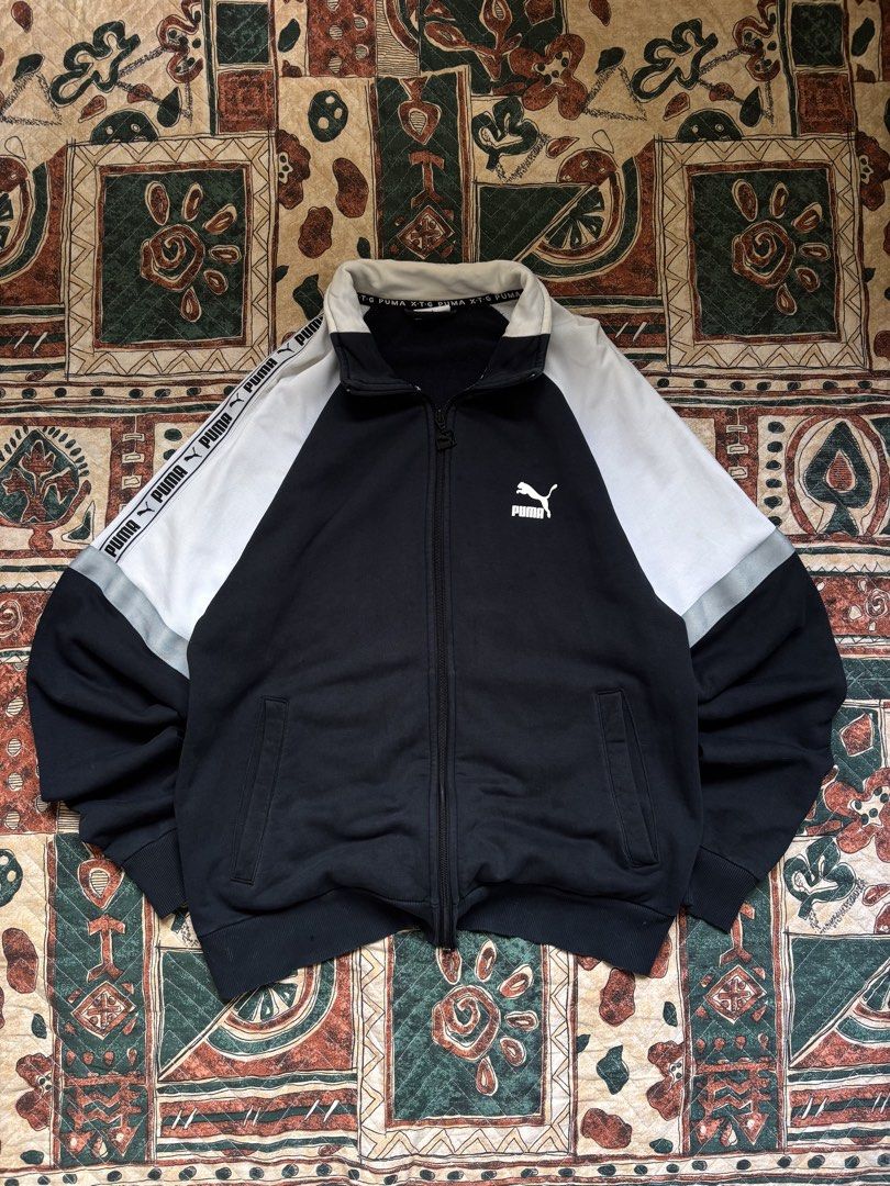 Puma XTG track Jacket (Category: Coats, Jackets and Outerwear) located in Baguio. Submitted by zojythriftph (Listing ID 1471025983, Image 1). Description: 26.5 × W20- Large Condition: Good used condition Flaws: Minor fraying on sleeve cuffs and small holes. Please manage expectations and check photos for details before buying. Color Rate- 9/10 Mine:290 📌 Disclaimer: For reselling purposes only. All branded items are thrifted/preloved. Wear more.