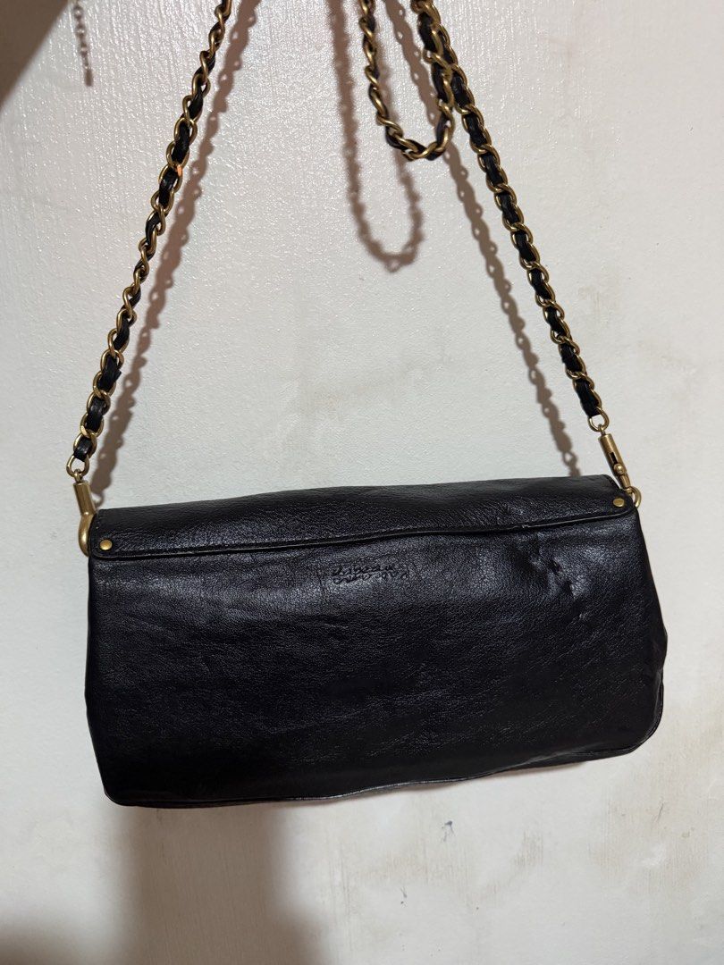 Rabeanco leather pouch/ shoulder bag (Category: Shoulder Bags) located in San Pablo. Submitted by prelovedbymistyblue (Listing ID 1470989657, Image 2). Description: Genuine leather Rabeanco pouch/shoulder bag. With removable chain strap. Only flaw is the dents on the leather. Many compartments. Still very nice. Measures 10 x 5.5 inches. Selling low for 1100 for geneuine leather Rabeanco. .