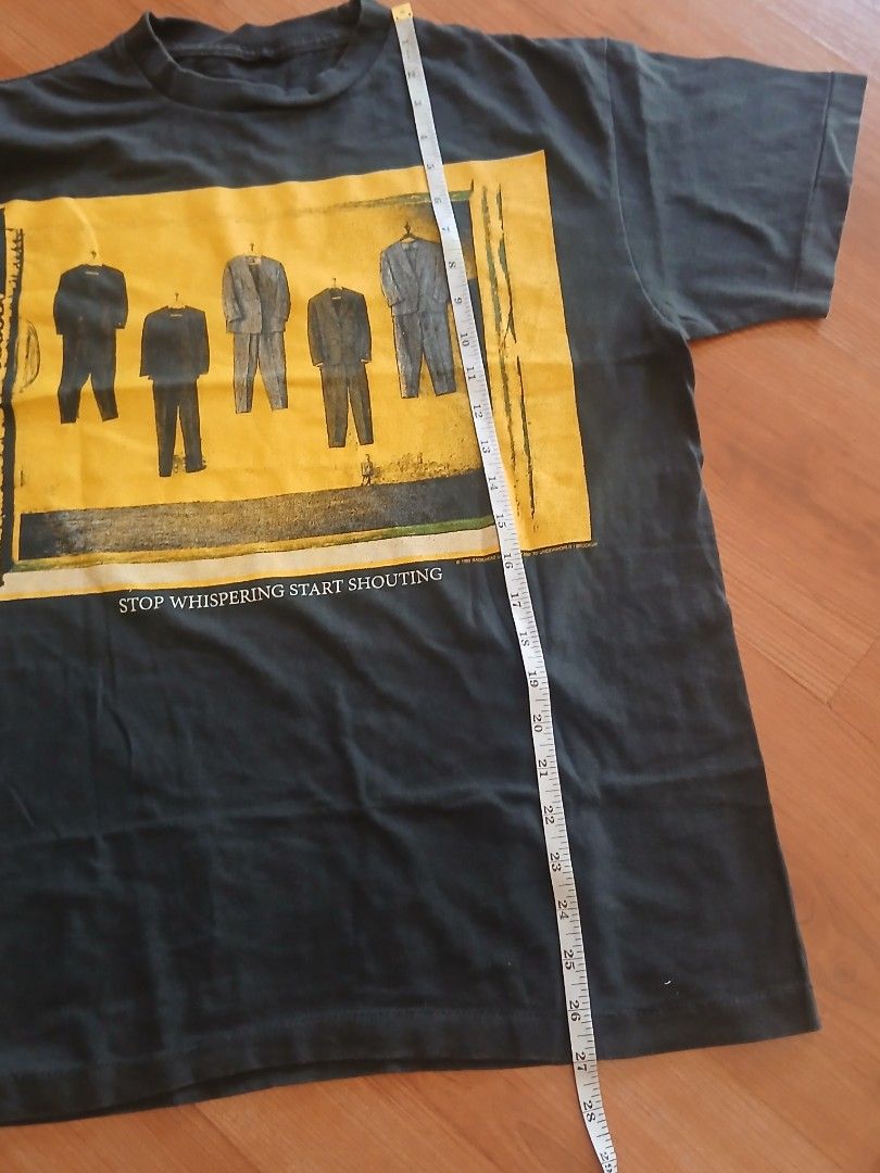 Radiohead Stop Whispering T-Shirt (Category: Tshirts & Polo Shirts ) located in Pasig City. Submitted by jmluna_iii45224 (Listing ID 1470988738, Image 3). Description: - Item: Vintage Radiohead Band T-Shirt - Color: Dark Grey - Material: 100% Cotton (super soft, broken-in feel) - Front Design: Suit illustrations with 'STOP WHISPERING START SHOUTING' text - Back Design: Vertical 'radiohead' and 'STOP WHISPERING' in yellow and blue print - Fit: Sho
