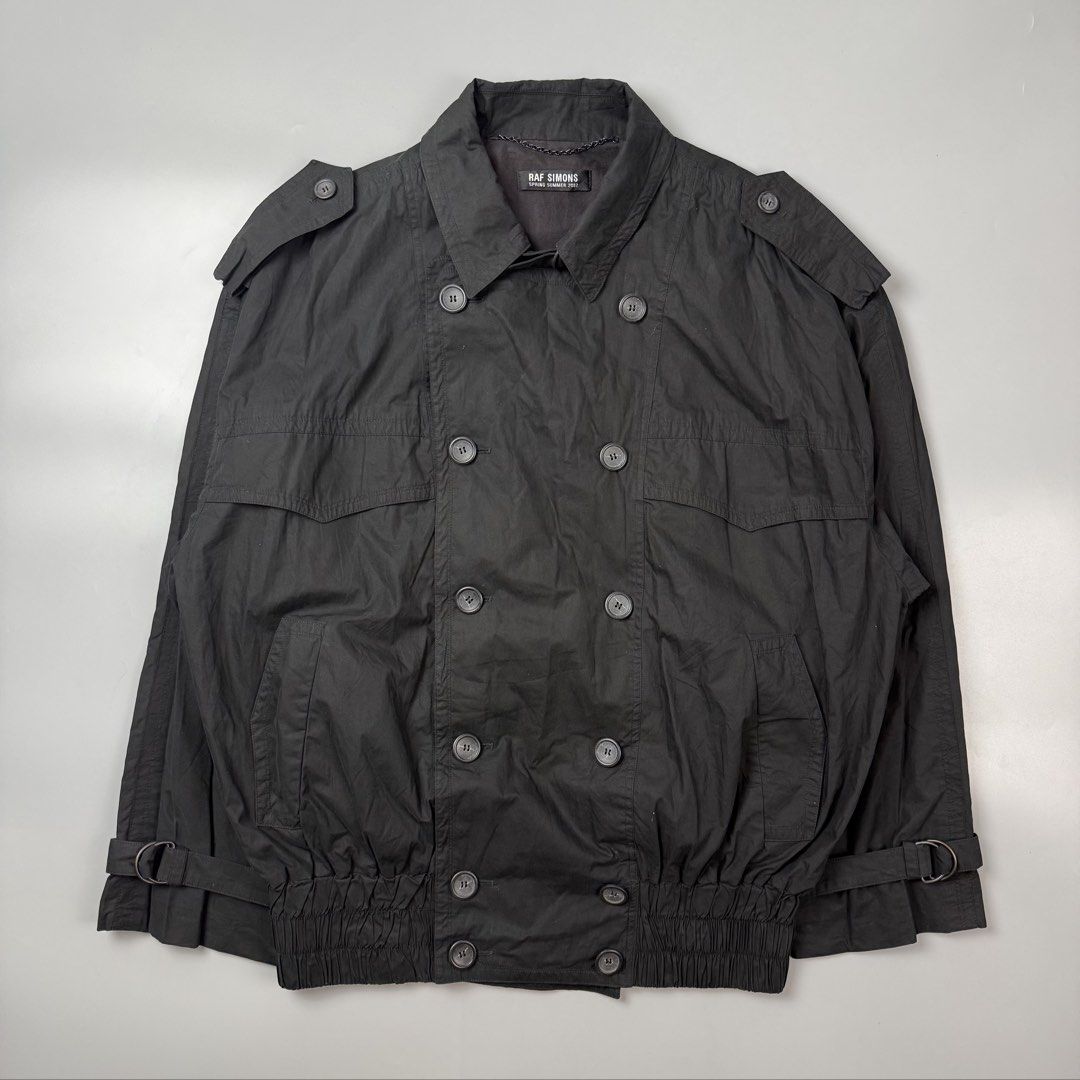 Raf Simons - S/S02 - “Fear Generation” Trench Bomber Jacket (Category: Coats, Jackets and Outerwear) located in Pasig City. Submitted by on_the_trend (Listing ID 1471094577, Image 3). Description: Tagged size: 46 Condition: 9/10 Material: 100% Cotton Made in: Belgium Measurement: Width: 27 inches Length: 29.5 inches.