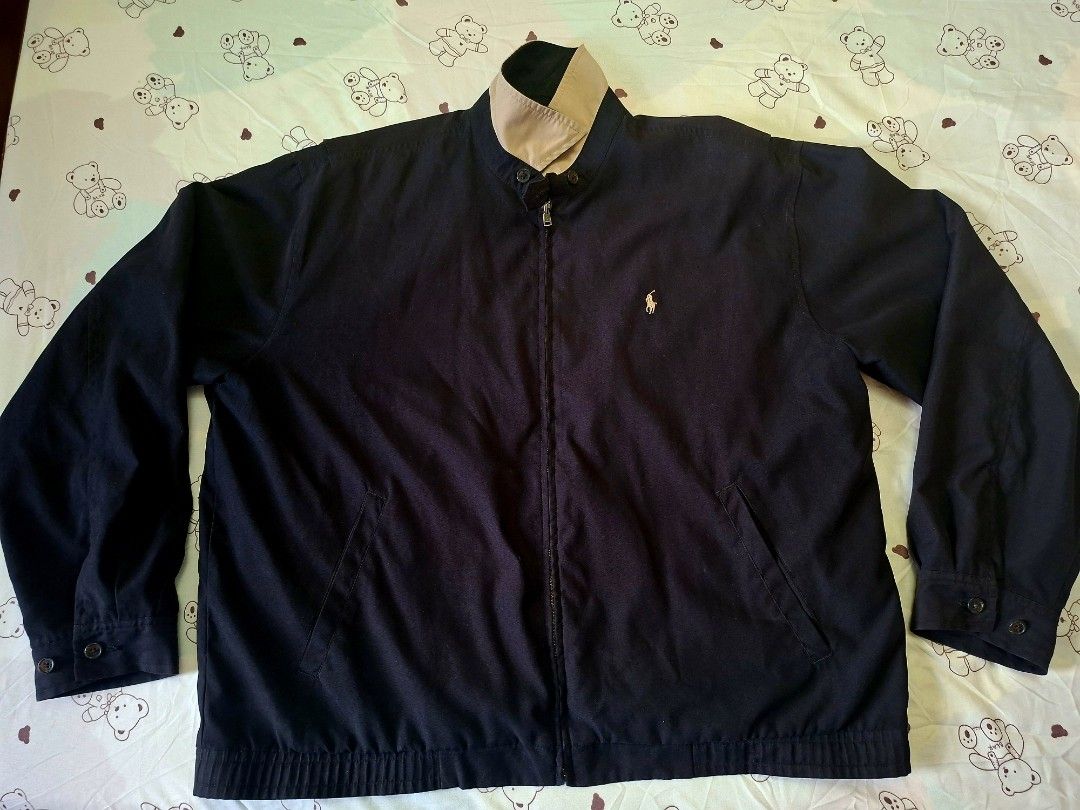Ralph Lauren Black Bi-Swing Harrington Jacket (Category: Coats, Jackets and Outerwear) located in Rizal. Submitted by carou66859 (Listing ID 1470992139, Image 1). Description: The image shows a black Polo Ralph Lauren Harrington zip-up jacket featuring a small embroidered Polo Pony logo on the chest and a plaid-lined collar.Size 26 inches width and 27 inches length.The estimated retail price for a new Polo Ralph Lauren Bi-Swing Windbreaker / Harr