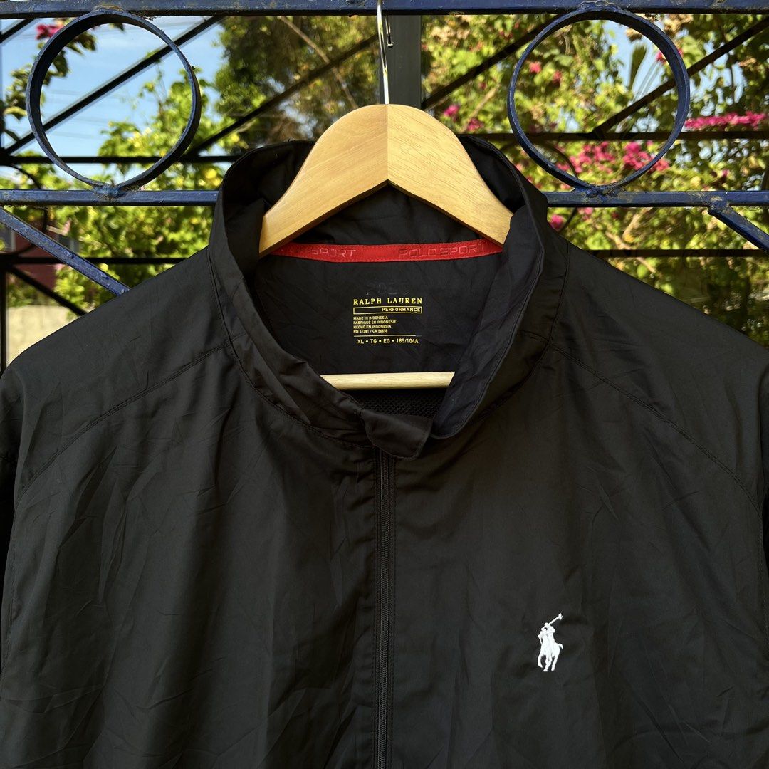 Ralph Lauren Performance Black Jacket Size XL (Category: Coats, Jackets and Outerwear) located in Davao. Submitted by streetsight (Listing ID 1471020930, Image 3). Description: - Brand: Ralph Lauren - Item: Performance Jacket - Color: Black with red zipper accents and collar lining - Size: XL (fits true to size) - Details: White embroidered pony logo on chest, full zip front with YKK hardware - Material: Lightweight polyester - Origin: Made in In