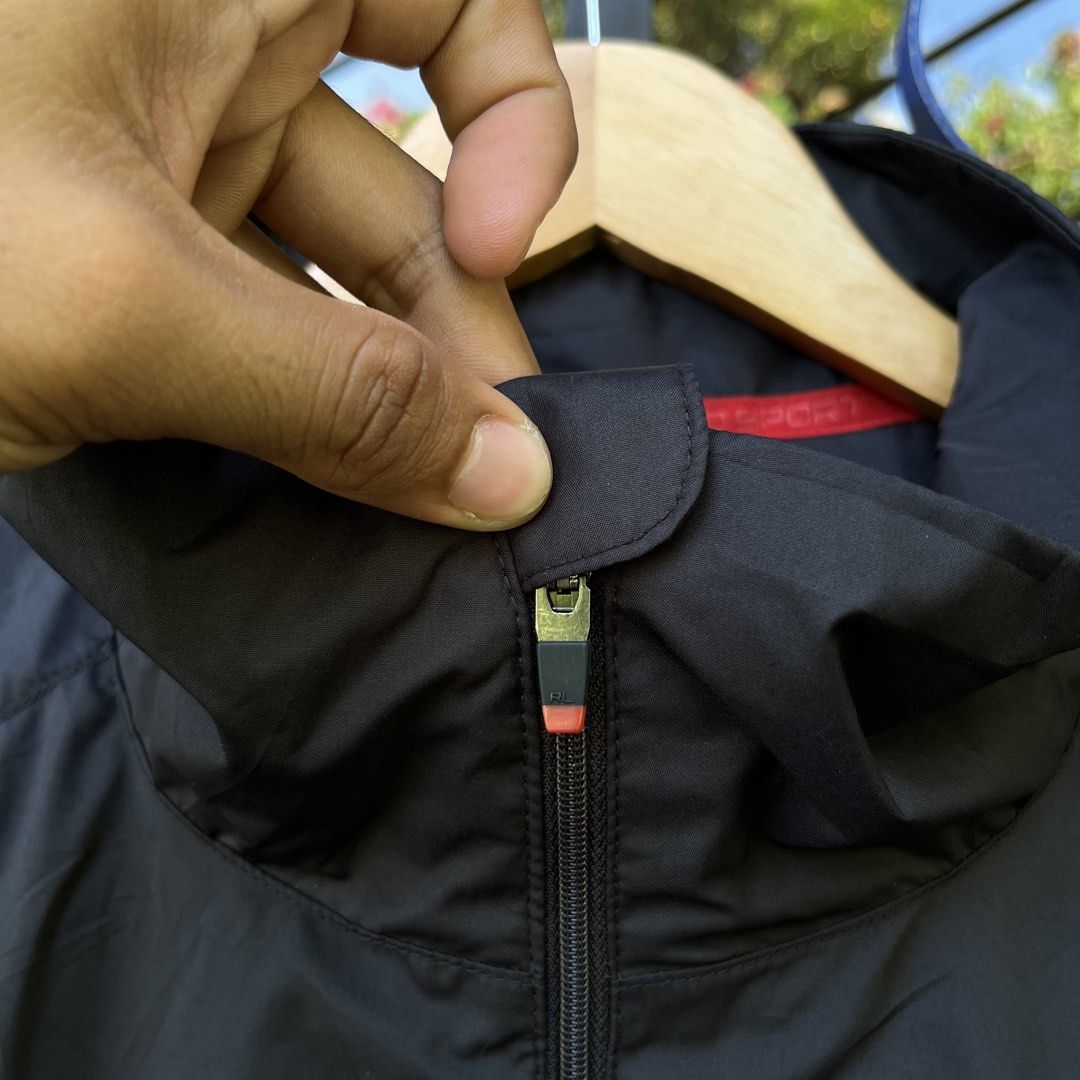Ralph Lauren Performance Black Jacket Size XL (Category: Coats, Jackets and Outerwear) located in Davao. Submitted by streetsight (Listing ID 1471020930, Image 2). Description: - Brand: Ralph Lauren - Item: Performance Jacket - Color: Black with red zipper accents and collar lining - Size: XL (fits true to size) - Details: White embroidered pony logo on chest, full zip front with YKK hardware - Material: Lightweight polyester - Origin: Made in In