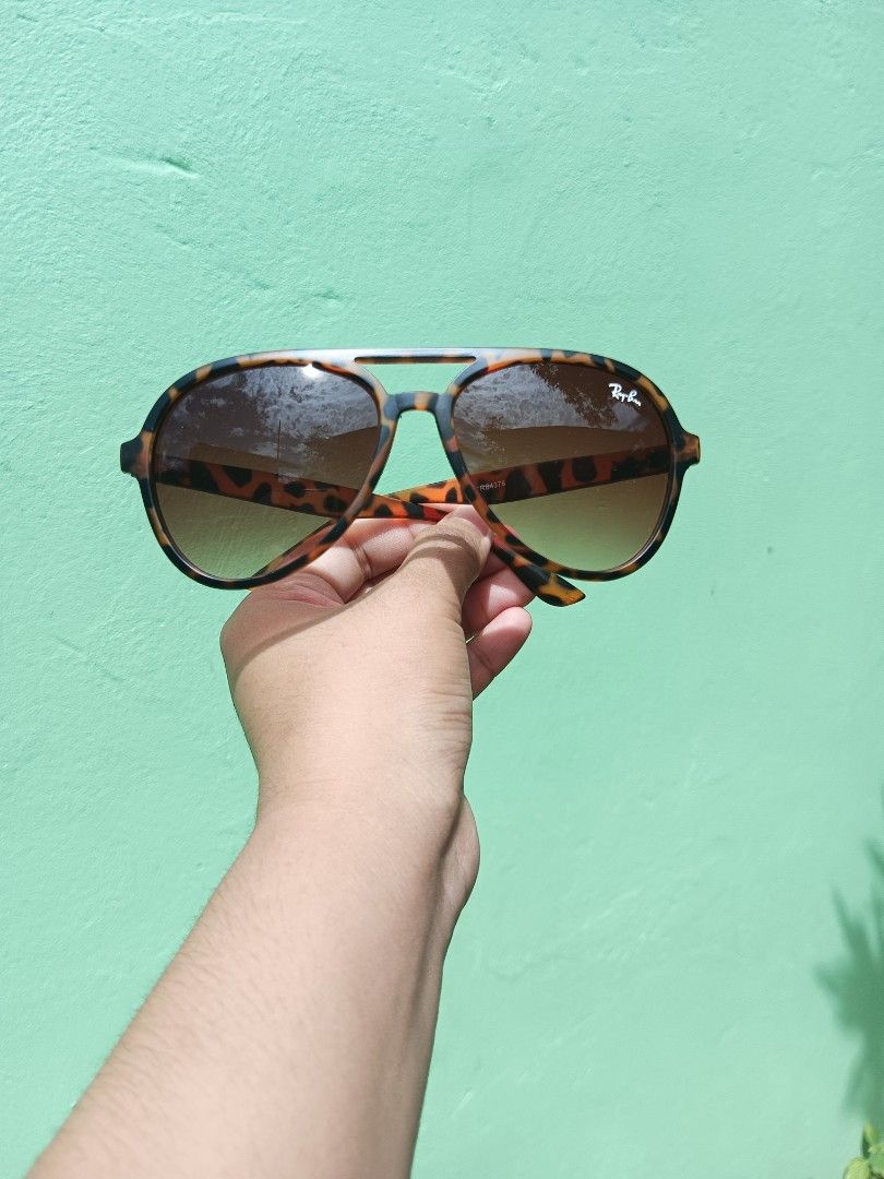 Ray-Ban Sunglasses Bundle Assorted Styles and Colors (Category: Sunglasses & Eyewear) located in Silang. Submitted by amara_apparel (Listing ID 1471113527, Image 3). Description: - Ray-Ban sunglasses collection available for individual purchase - Variety of iconic frames: Round, Square, Aviator, and Gradient lens designs - Frame & lens color options: Transparent grey, matte black, tortoise shell, and folding brown - Signature details: White Ray-B