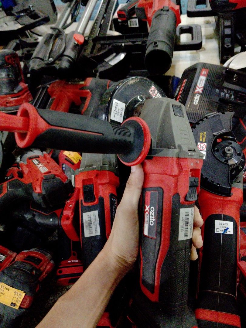 Red and Black Power Tool with Handle (Category: Construction Tools & Equipment) located in Manila. Submitted by kamanowkhmr (Listing ID 1470941221, Image 3). Description: - Color: Striking red and black design - Design: Large top handle for easy gripping and comfortable use - Features: Conveniently placed power button near the top grip and included black hose attachment - Condition: Used with some stickers/labels on the body, but fully functional