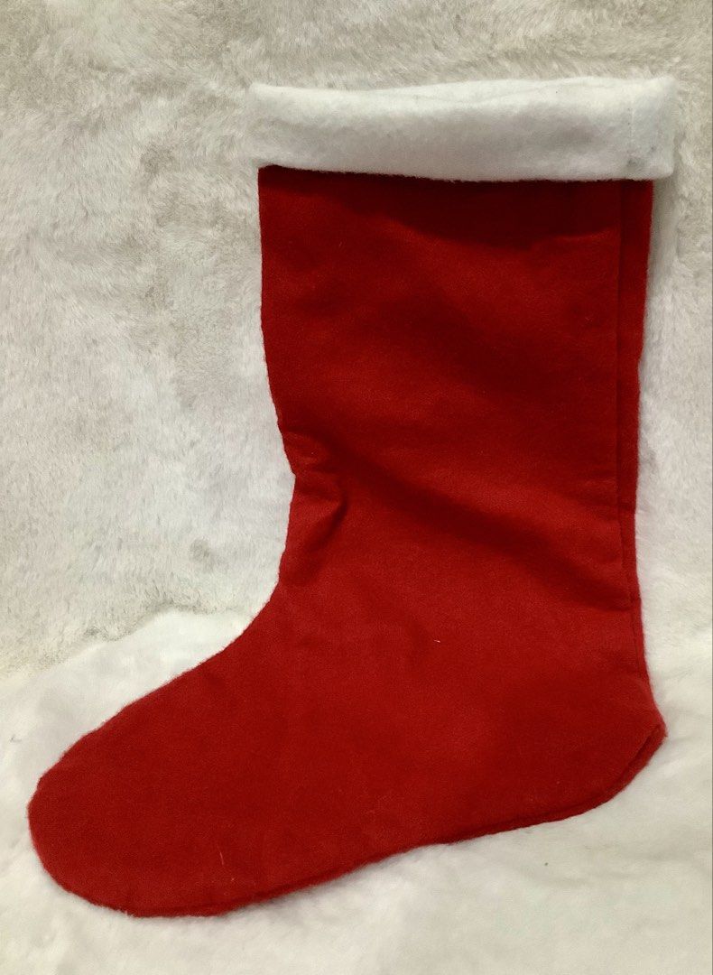 Red Christmas Stocking with Santa and Star Design (Category: Wall Decor) located in Quezon City. Submitted by heybailey (Listing ID 1471010982, Image 2). Description: - Festive red Christmas stocking with a traditional holiday design DIMEMSIONS WIDTH: 7 inches LENGTH: 17.5 inches - Features a smiling Santa holding a yellow star on the front - Accented with a cozy white fluffy cuff and scattered white star appliques - Plain red back with an attach