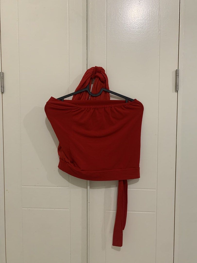 Red Halter Crop Top with Tie Detail (Category: Sleeveless) located in Pasig City. Submitted by lovedbyri (Listing ID 1470960576, Image 2). Description: - Color: Vibrant red - Style: Crop top with built-in halter neck drape and long side tie - Fabric: Soft and stretchy for a comfortable fit - Ideal for: Nights out, parties, and events - Easy to pair: Looks great with high-waisted jeans or skirts - Condition: Clean and ready to wear.