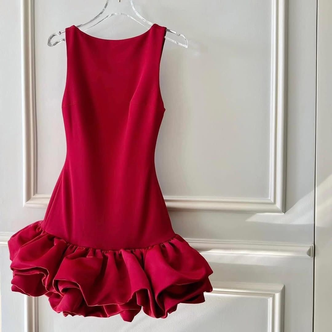 Red mini dress with dramatic ruffle hem (Category: Dresses) located in Manila. Submitted by cielopenaf02780 (Listing ID 1471063430, Image 1). Description: - Color: Vibrant red - Style: Sleeveless mini dress with dramatic voluminous ruffle hem - Fit: Fitted bodice with low scoop back and hidden back zipper closure - Material: Smooth fabric with slight stretch for comfort - Occasion: Perfect for parties, dates, or nights out - Note: Measurements av
