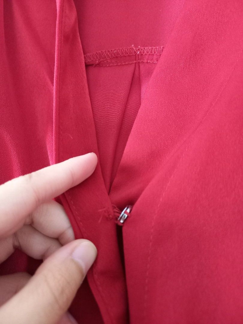 Red sleeveless v-neck top (Category: Blouses) located in San Pedro. Submitted by ceratopogonidae (Listing ID 1470965833, Image 2). Description: But needs stitching but no other flaws. Best fit L-XL, silky material.