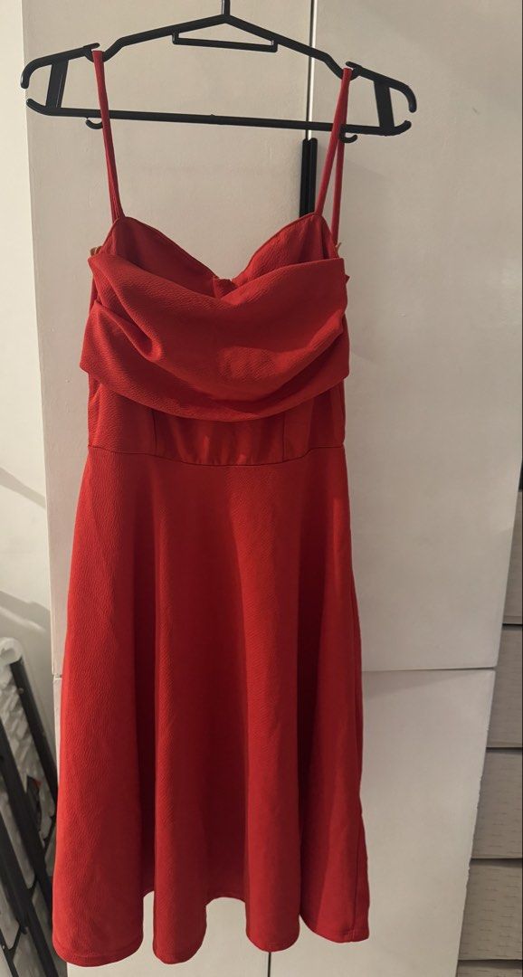 Red Spaghetti Strap Draped Neck Mini Dress (Category: Dresses) located in Valenzuela. Submitted by tricegonzales (Listing ID 1470991956, Image 1). Description: - Color: Vibrant solid red (no patterns) - Style: Sleeveless with thin spaghetti straps and a classy foldover draped neckline - Fit: Fitted waistline with a flattering flared A-line skirt - Length: Knee-length - Material: Textured fabric throughout - Condition: Clean and ready to wear - Pe