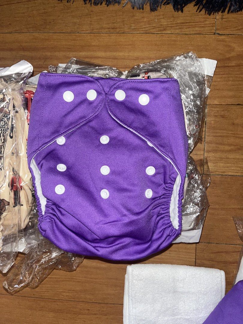 Reusable Cloth Diapers Set with Inserts (Category: Diapers & Baby Wipes) located in Quezon City. Submitted by bimbohazeee (Listing ID 1470951019, Image 2). Description: FOR TAKEALL CLOTH DIAPERS!! bought from rustan's and brand new pa never used 3 diff designs good for 0-9mos baby rfs: di na nagamit ni LO since nagstick kami sa dispo diapers.