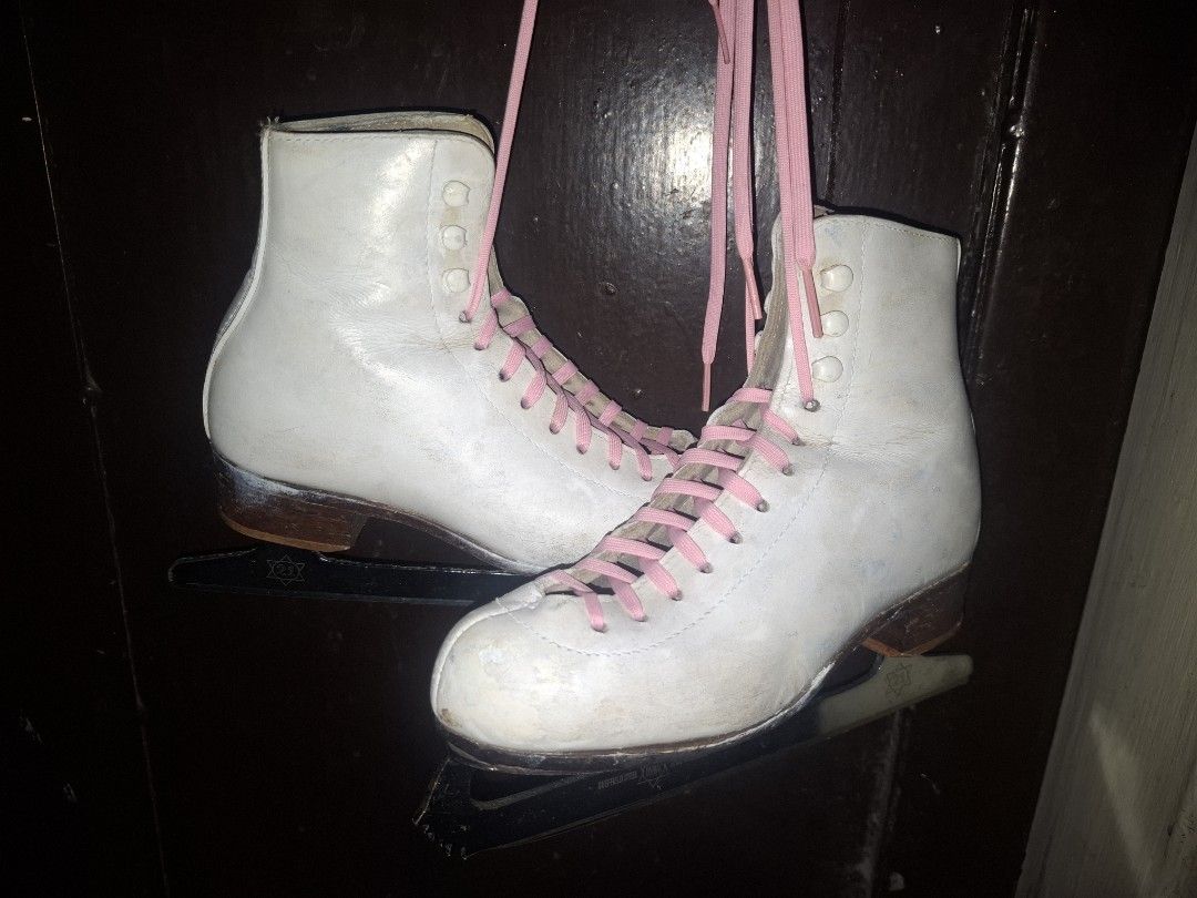 Riedell White Ice Skates with Pink Laces (Category: Skates, Rollerblades & Scooters) located in Taguig. Submitted by hanniedew (Listing ID 1471083113, Image 3). Description: - Authentic Riedell ice skates, proudly made in the USA - Genuine white leather boots with classic brown stacked heels - Traditional figure skating setup fitted with vibrant bright pink laces - Sturdy metal blades included, ready for the rink - Soles feature stamped Riedell b