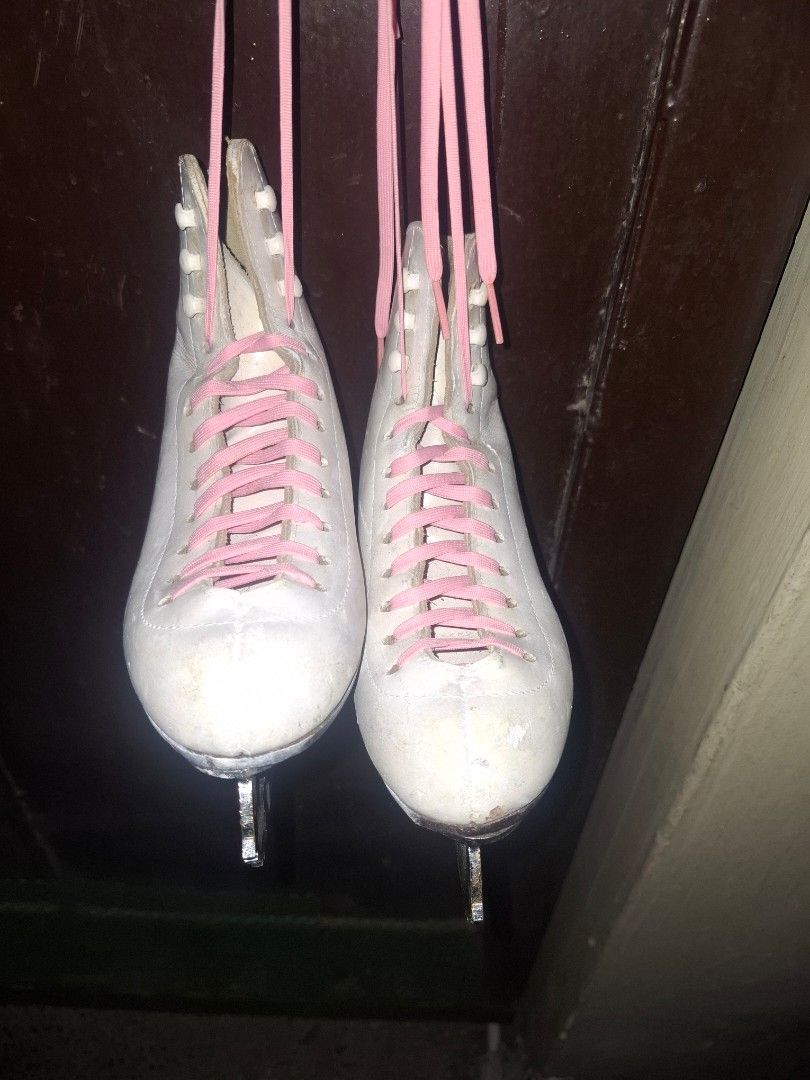 Riedell White Ice Skates with Pink Laces (Category: Skates, Rollerblades & Scooters) located in Taguig. Submitted by hanniedew (Listing ID 1471083113, Image 1). Description: - Authentic Riedell ice skates, proudly made in the USA - Genuine white leather boots with classic brown stacked heels - Traditional figure skating setup fitted with vibrant bright pink laces - Sturdy metal blades included, ready for the rink - Soles feature stamped Riedell b
