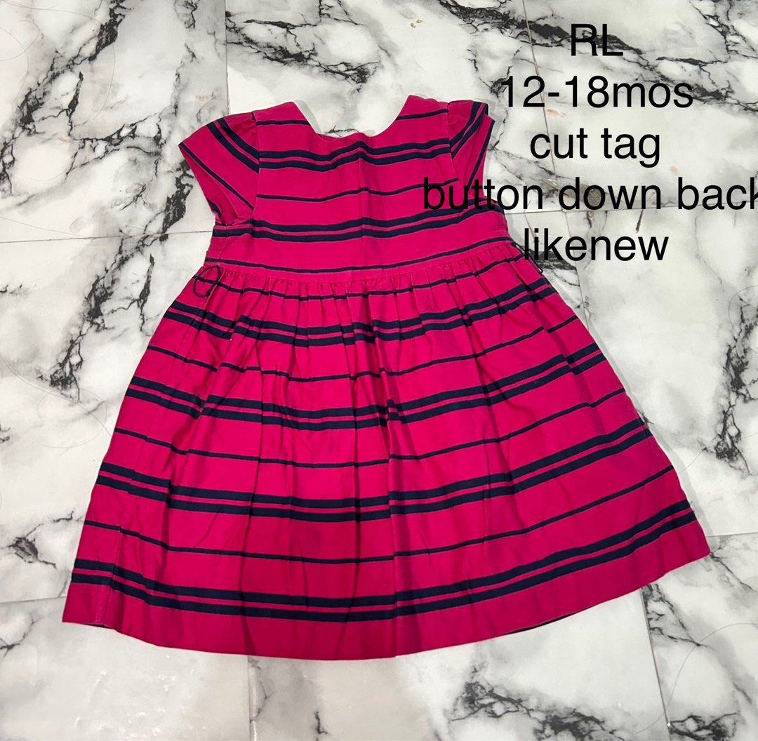 RL Striped Button Down Back Dress 12-18M (Category: Babies & Kids Fashion) located in Rizal. Submitted by threegoddess (Listing ID 1471083370, Image 1). Description: - Size: 12 to 18 months - Color/Design: Pink and navy blue stripes - Features: Short sleeves, pleated skirt bottom, and convenient back button closure - Condition: Clean, crisp, and unworn (brand tag on the collar area has been cut) - Style tip: Adorable and comfortable outfit for yo