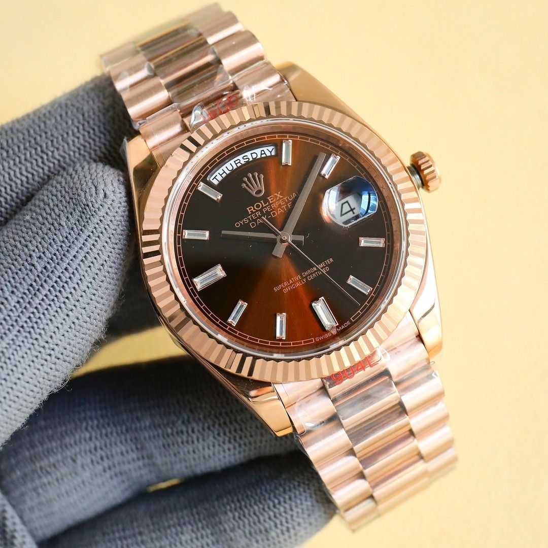 Rolex Day-Date Rose Gold Watch (Category: Luxury Watches) located in Marikina City. Submitted by coolocean-c9274f (Listing ID 1471009401, Image 2). Description: - Model: Rolex Day-Date - Material: Rose Gold - Dial: Brown sunburst with baton hour markers - Bezel: Fluted - Bracelet: Iconic President bracelet - Features: Day window at 12 o'clock and date display at 3 o'clock with cyclops lens - Condition: Brand new with factory protective plastic wr