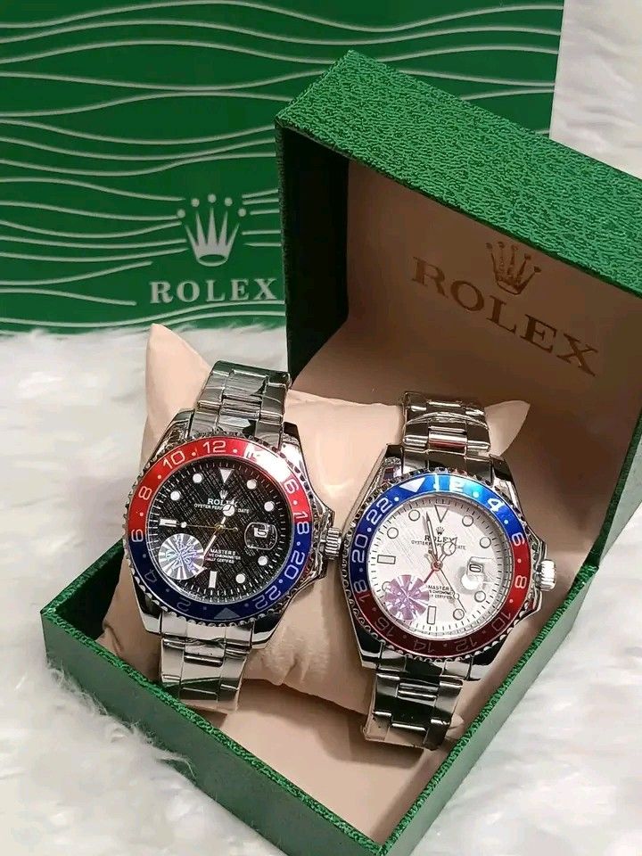 Rolex GMT-Master II Automatic Watch with Box (Category: Luxury Watches) located in Manila. Submitted by silvermoon_b802e0 (Listing ID 1471061958, Image 3). Description: Rolex GMT-Master II watch in green presentation box. Stainless steel bracelet with protective blue plastic wrap still attached. Rotating bezel with red and blue accents. Textured dial with date window at the three o'clock position. Exhibition glass case back exposing automatic mov