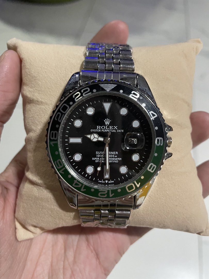 Rolex Submariner Oyster Perpetual Date Watch (Category: Luxury Watches) located in Manila. Submitted by hype_activity07 (Listing ID 1470979462, Image 1). Description: - Model: Rolex Submariner Oyster Perpetual Date - Dial: Classic black with silver hands and hour markers, plus 'Swiss Made' text - Bezel: Green and black rotating bezel with 24-hour markings - Bracelet: Silver stainless steel Jubilee bracelet - Features: Date window at 3 o'clock wit