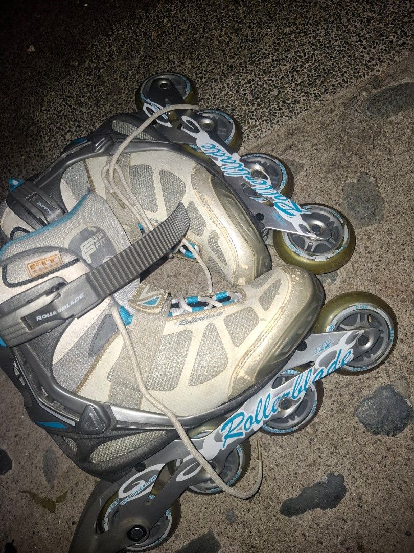 Rollerblade Inline Skates Size 38 CM 24.0 (Category: Skates, Rollerblades & Scooters) located in Taguig. Submitted by hanniedew (Listing ID 1471082615, Image 3). Description: Rollerblade inline skates, grey and white with blue accents. 80mm max wheels installed. Standard laces, velcro strap, and plastic ankle buckle closure. Size : EU 38, UK 5, US W7, CM 24.0. Some scuffs and wear marks on the toes and frame from regular use. Wheels and the insid