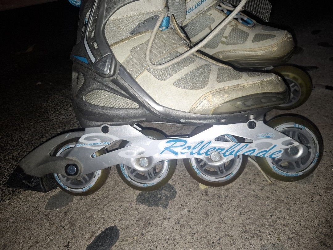 Rollerblade Inline Skates Size 38 CM 24.0 (Category: Skates, Rollerblades & Scooters) located in Taguig. Submitted by hanniedew (Listing ID 1471082615, Image 2). Description: Rollerblade inline skates, grey and white with blue accents. 80mm max wheels installed. Standard laces, velcro strap, and plastic ankle buckle closure. Size : EU 38, UK 5, US W7, CM 24.0. Some scuffs and wear marks on the toes and frame from regular use. Wheels and the insid
