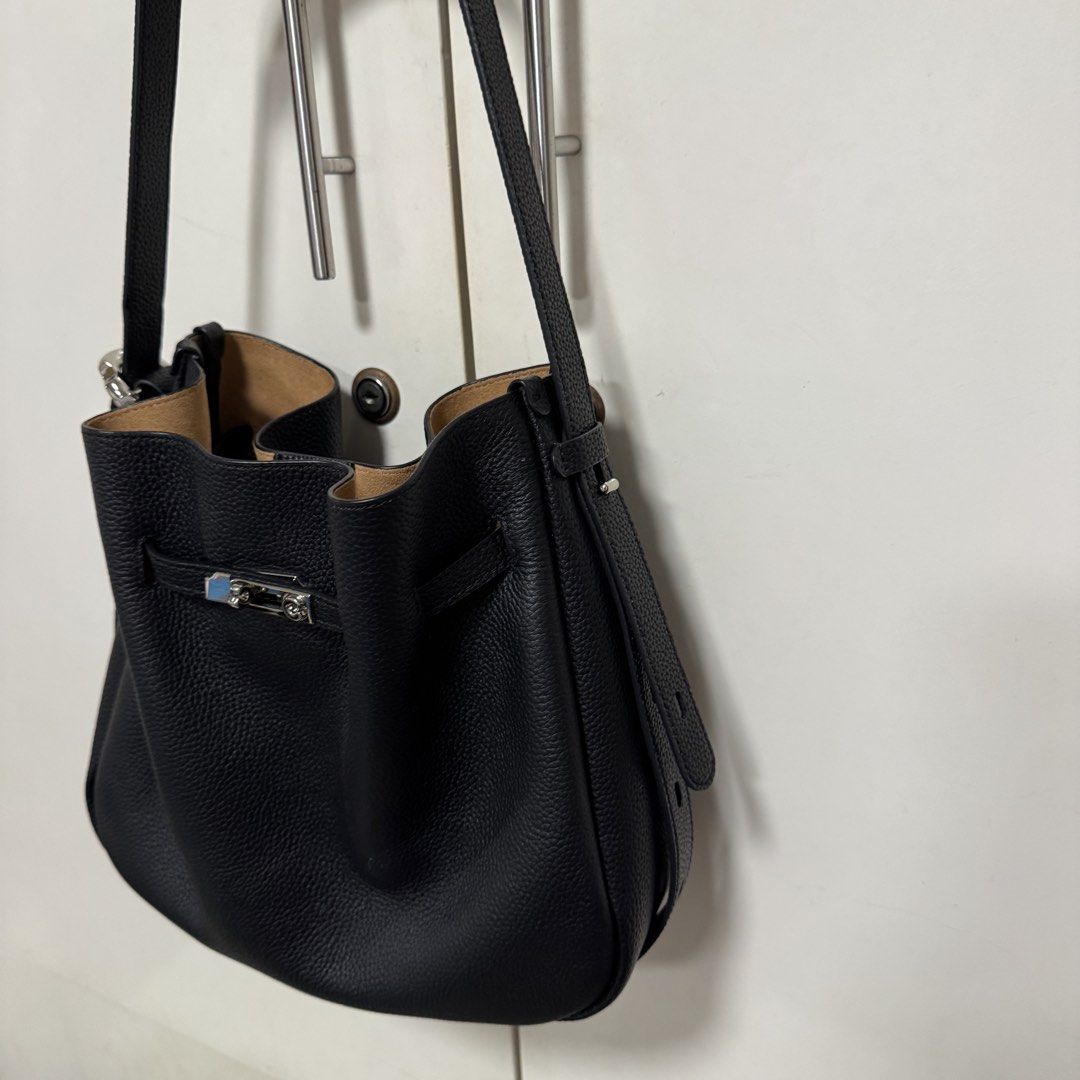 ROMYTISA Drawstring Lock Shoulder Bucket Bag (Category: Shoulder Bags) located in Manila. Submitted by caramelbliss (Listing ID 1471041796, Image 3). Description: This sophisticated bucket bag exemplifies urban simplicity with its clean lines and functional drawstring closure. Crafted from premium top-grain cowhide leather, it offers a perfect blend of luxury and practicality. The versatile design and medium size make it an ideal companion for th