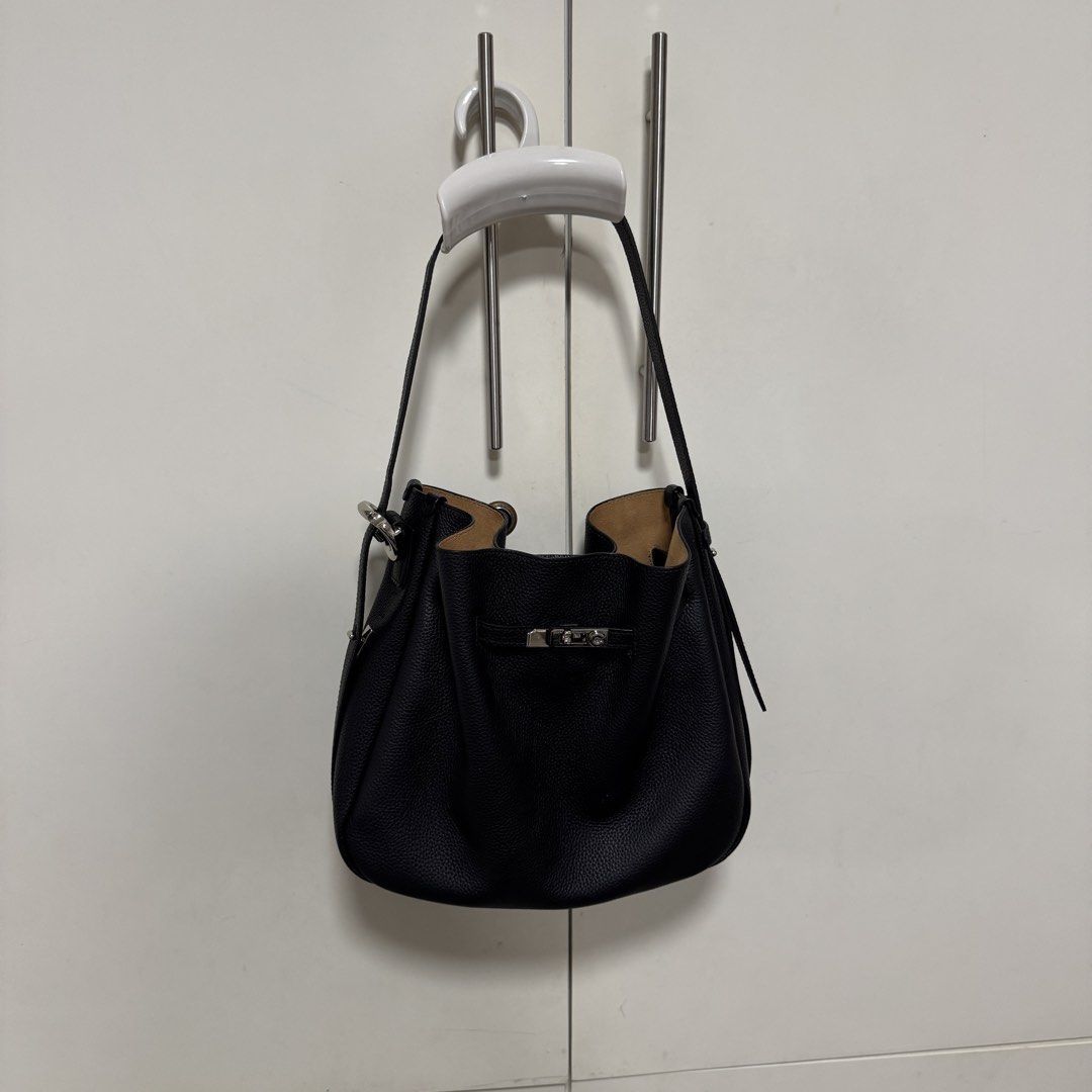 ROMYTISA Drawstring Lock Shoulder Bucket Bag (Category: Shoulder Bags) located in Manila. Submitted by caramelbliss (Listing ID 1471041796, Image 2). Description: This sophisticated bucket bag exemplifies urban simplicity with its clean lines and functional drawstring closure. Crafted from premium top-grain cowhide leather, it offers a perfect blend of luxury and practicality. The versatile design and medium size make it an ideal companion for th