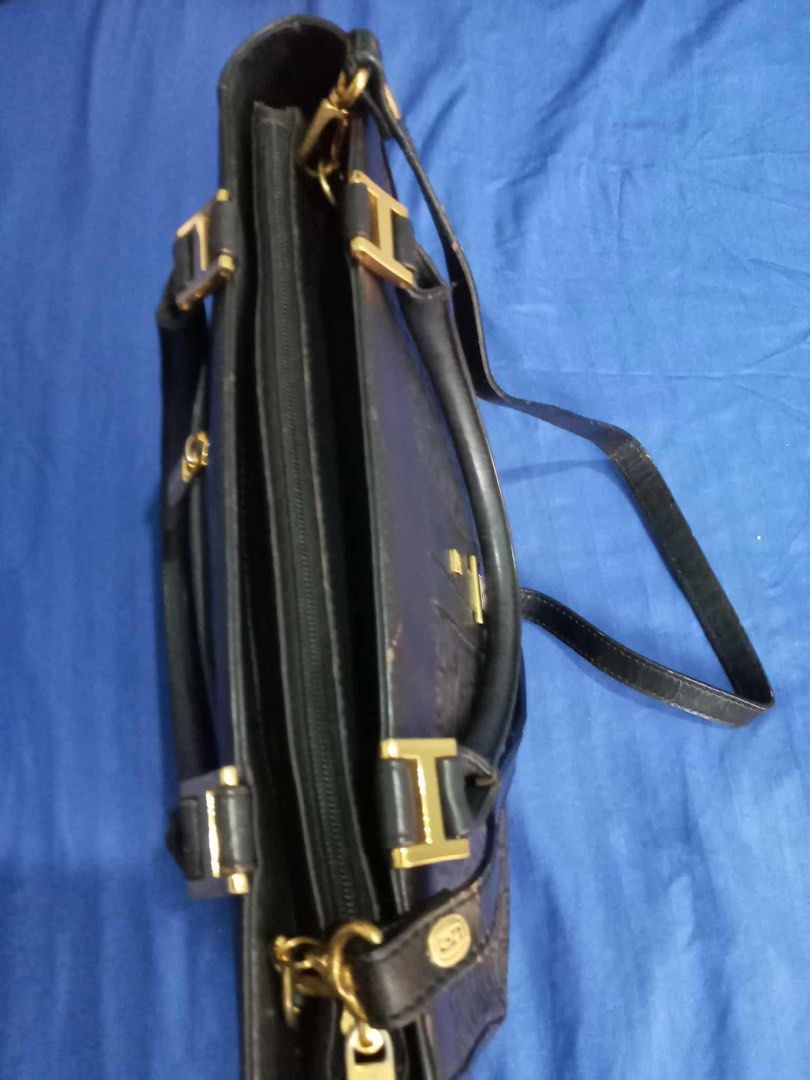 RUSH SALE!! Authentic Pierre Cardin Paris Black Patterned Handbag with Strap (Category: Luxury Bags & Wallets) located in Quezon City. Submitted by unique2shop (Listing ID 1470990411, Image 3). Description: - Brand: Pierre Cardin Paris - Color: Classic black with monogram patterned side panels - Hardware: Gold tone with branded zipper pull - Straps: Includes top carry handles and a detachable shoulder strap - Interior: Branded fabric lining with 