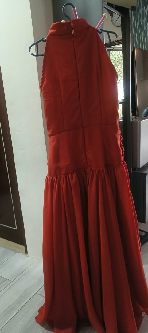 Rust Orange Bridesmaid halter neck dress (Category: Dresses) located in Abucay. Submitted by charkolefishies (Listing ID 1471003071, Image 3). Description: - Color: Rust orange - Style: Halter neck maxi dress with a pleated skirt - Details: Cinched draped waistline - Condition: Worn once, clean, and ready to wear.