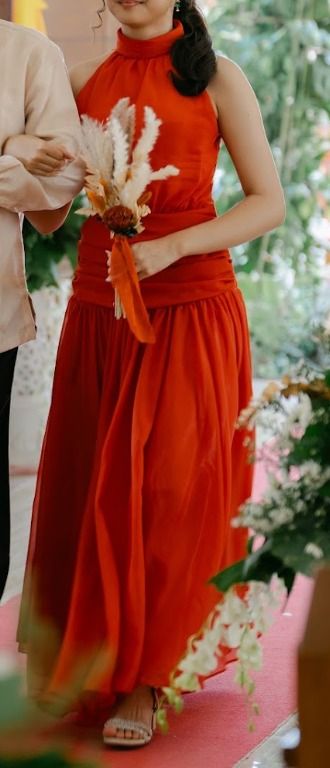 Rust Orange Bridesmaid halter neck dress (Category: Dresses) located in Abucay. Submitted by charkolefishies (Listing ID 1471003071, Image 1). Description: - Color: Rust orange - Style: Halter neck maxi dress with a pleated skirt - Details: Cinched draped waistline - Condition: Worn once, clean, and ready to wear.