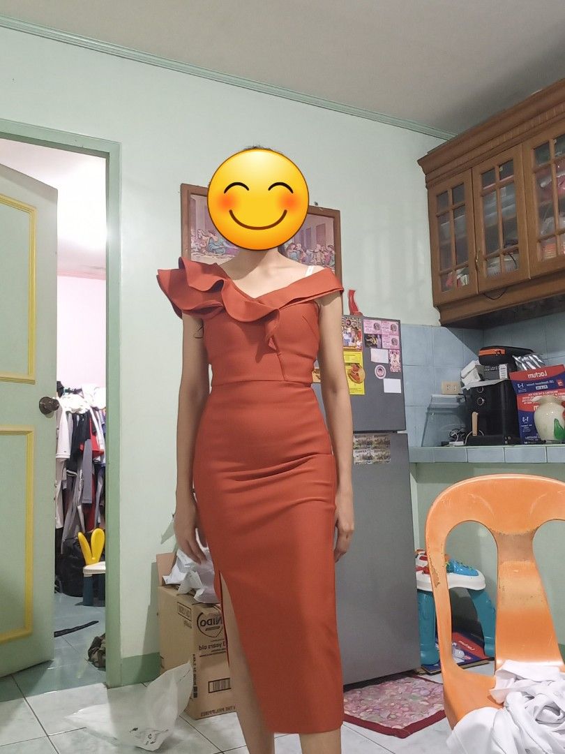 Rust Orange One-Shoulder Ruffle Midi Dress (Category: Dresses) located in San Fernando. Submitted by maryann_25 (Listing ID 1471057795, Image 3). Description: - Color: Rust Orange - Style: Asymmetric one-shoulder with dramatic ruffle trim - Fit: Bodycon bodice and hips with a straight mid-calf skirt and high side slit - Fabric: Smooth with a bit of stretch for comfort - Occasion: Perfect statement piece for dinners, parties, and special events.