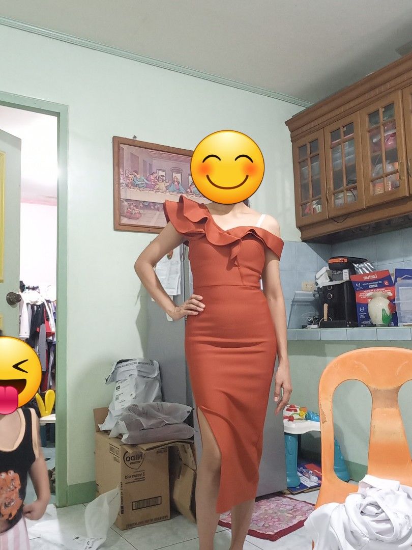 Rust Orange One-Shoulder Ruffle Midi Dress (Category: Dresses) located in San Fernando. Submitted by maryann_25 (Listing ID 1471057795, Image 2). Description: - Color: Rust Orange - Style: Asymmetric one-shoulder with dramatic ruffle trim - Fit: Bodycon bodice and hips with a straight mid-calf skirt and high side slit - Fabric: Smooth with a bit of stretch for comfort - Occasion: Perfect statement piece for dinners, parties, and special events.