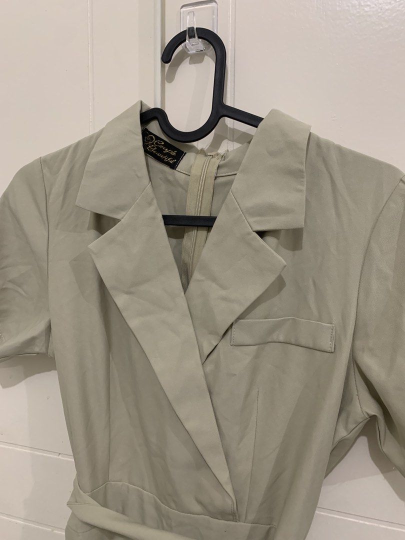 Sage Green Blazer Romper Playsuit with Belt (Category: Rompers) located in Pasig City. Submitted by lovedbyri (Listing ID 1471005555, Image 2). Description: - Color: Trendy sage green - Style: Blazer playsuit with short sleeves and notched collar - Details: Chest pocket, clean structured look, and smooth fabric - Closure: Back zipper - Bonus: Includes matching waist tie belt to cinch your waist.