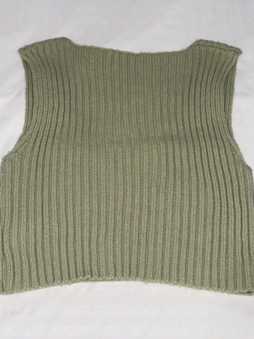 Sage Green Ribbed Knit Crop Vest (Category: Sleeveless) located in San Mateo. Submitted by cheeetosjalapeno (Listing ID 1471005698, Image 2). Description: ✨DECLUTTERING SALE✨ Condition: USED ONCE Location: San Mateo, Rizal - Color: Sage green - Style: Cropped knitted vest with deep V-neckline - Texture: Thick all-over ribbed design - Material: Soft, high-stretch fabric - Versatility: Great for layering over tees or wearing solo.