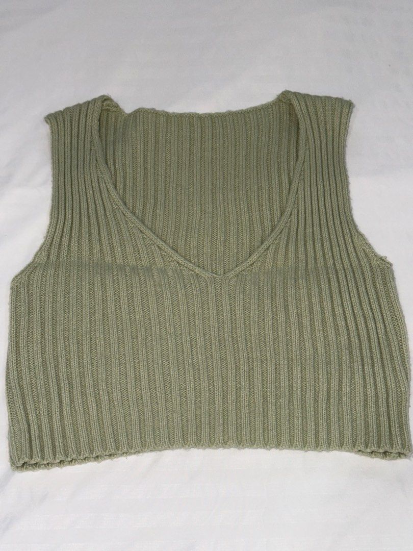 Sage Green Ribbed Knit Crop Vest (Category: Sleeveless) located in San Mateo. Submitted by cheeetosjalapeno (Listing ID 1471005698, Image 1). Description: ✨DECLUTTERING SALE✨ Condition: USED ONCE Location: San Mateo, Rizal - Color: Sage green - Style: Cropped knitted vest with deep V-neckline - Texture: Thick all-over ribbed design - Material: Soft, high-stretch fabric - Versatility: Great for layering over tees or wearing solo.