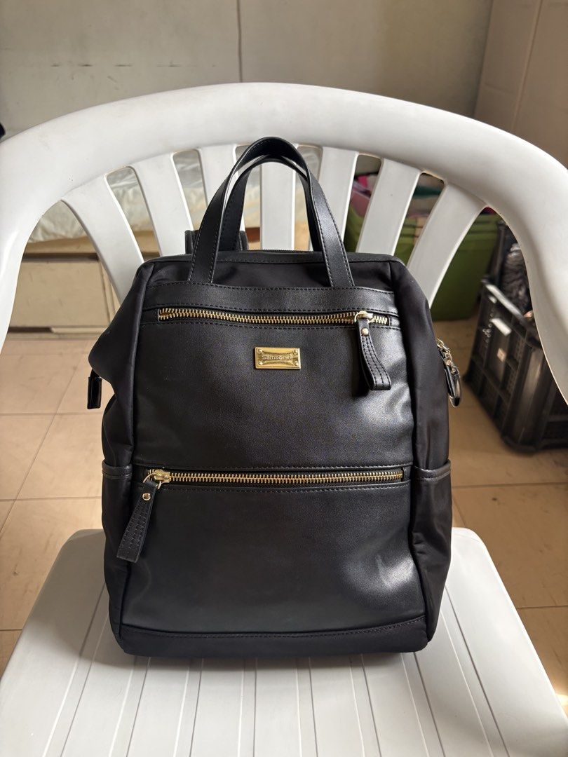 Samsonite Black Backpack with Gold Zippers (Category: Backpacks) located in Quezon City. Submitted by rottiemom (Listing ID 1470991062, Image 1). Description: - Brand: Samsonite - Color: Classic Black with elegant Gold hardware - Exterior: 2 front zippered compartments, branded gold plaque, and convenient side pockets - Straps & Handles: Top grab handles and adjustable padded shoulder straps with stylish metal buckles - Condition: Clean interior 