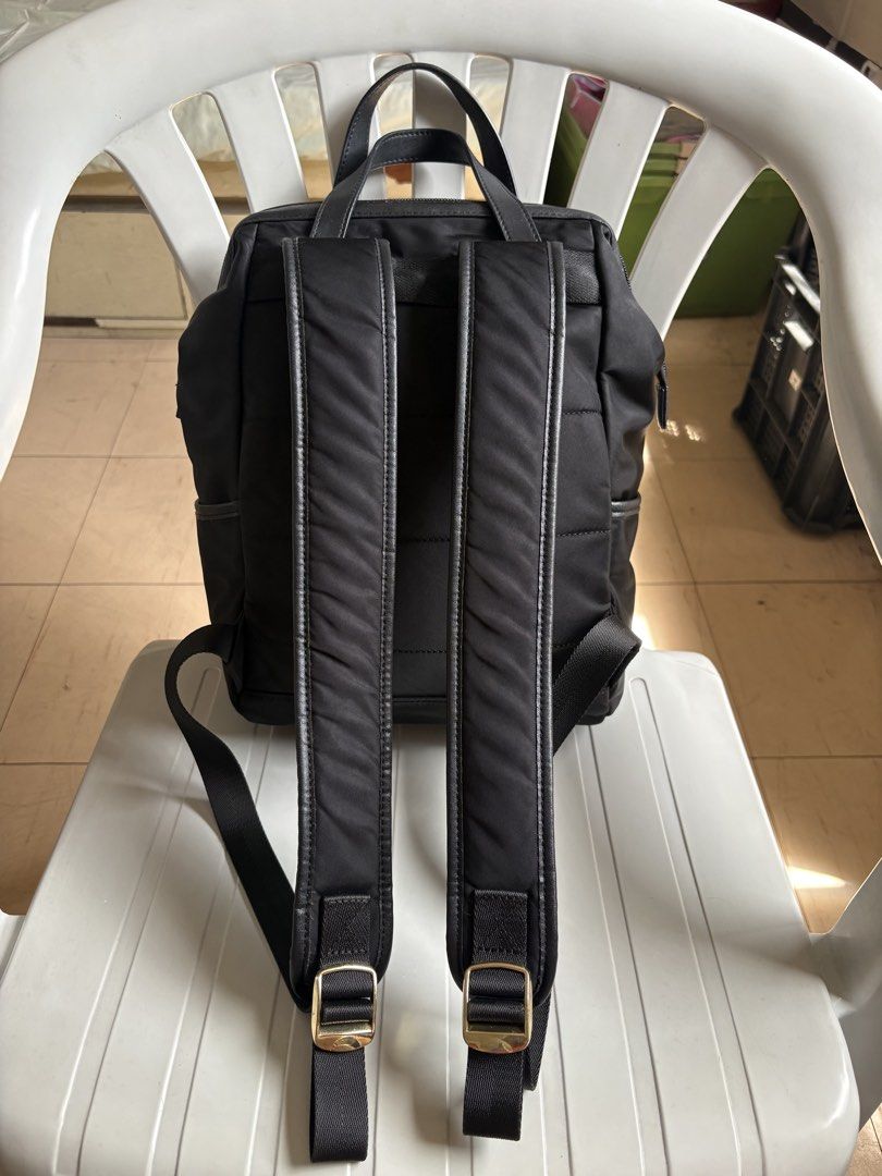 Samsonite Black Backpack with Gold Zippers (Category: Backpacks) located in Quezon City. Submitted by rottiemom (Listing ID 1470991062, Image 2). Description: - Brand: Samsonite - Color: Classic Black with elegant Gold hardware - Exterior: 2 front zippered compartments, branded gold plaque, and convenient side pockets - Straps & Handles: Top grab handles and adjustable padded shoulder straps with stylish metal buckles - Condition: Clean interior 